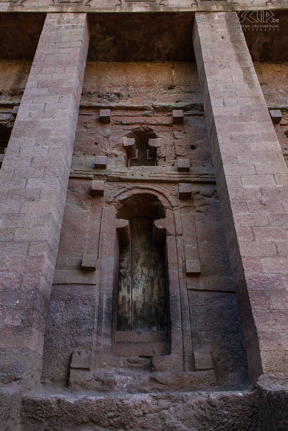 Lalibela - Bet Medhame Alem church Lalibela is a small town in northern Ethiopia that is famous for its 11 monolithic rock-cut churches from the 13th century which are built by king Lalibela. They are sometimes regarded as one the 8th wonder of the world and they are part of the UNESCO's world heritage site. The world churches are divided in two groups, the northern and the southern cluster separated by a small stream called the Jordan river. A detail of the Bet Medhame Alem church, which is the largest monolithic rock-hewn church in the world, it is 11.5m high and covers an area of about 800 square meters.  Stefan Cruysberghs